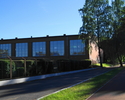 Zdjęcie przedstawia budynek hali sportowej przy Gimnazjum Miejskim nr 1 w Sławnie.                                                                                                                      