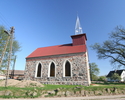 Na zdjęciu znajduję się ściana boczna kościoła, który został odbudowany w latach 2004-2006.                                                                                                             