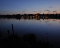 Zdjęcie przedstawia wieczorną panoramę Wolina ze wschodniego brzegu Dziwny                                                                                                                              